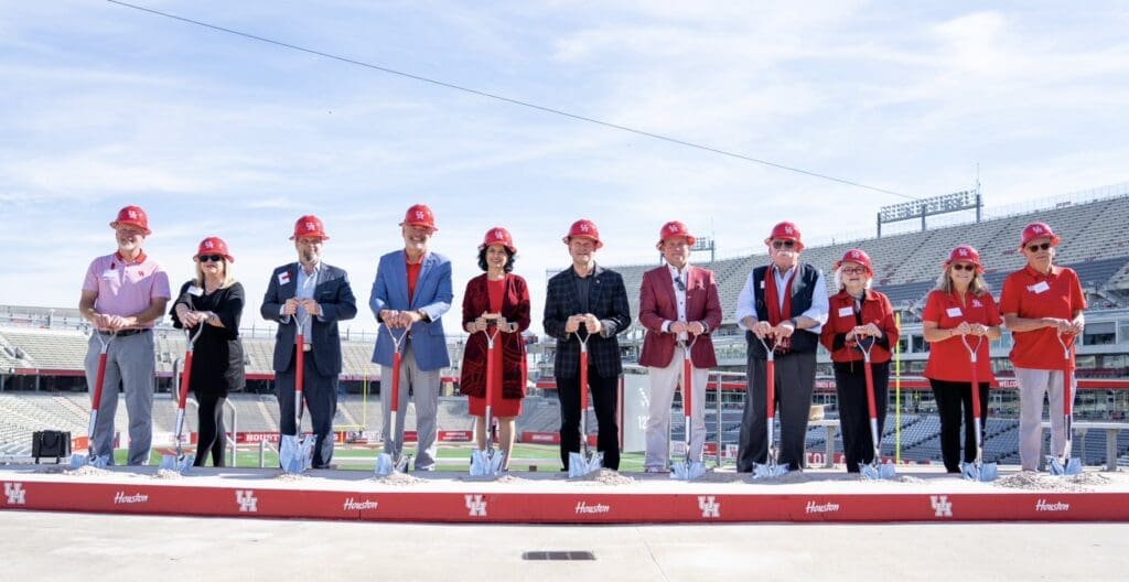 Athletic director Chris Pezman, president Renu Khator, board of regents chairman Tilman Fertitta and football coach Dana Holgorsen stood side by side at the Memorial Hermann Football Operations Center groundbreaking. (@UHCougarFB)