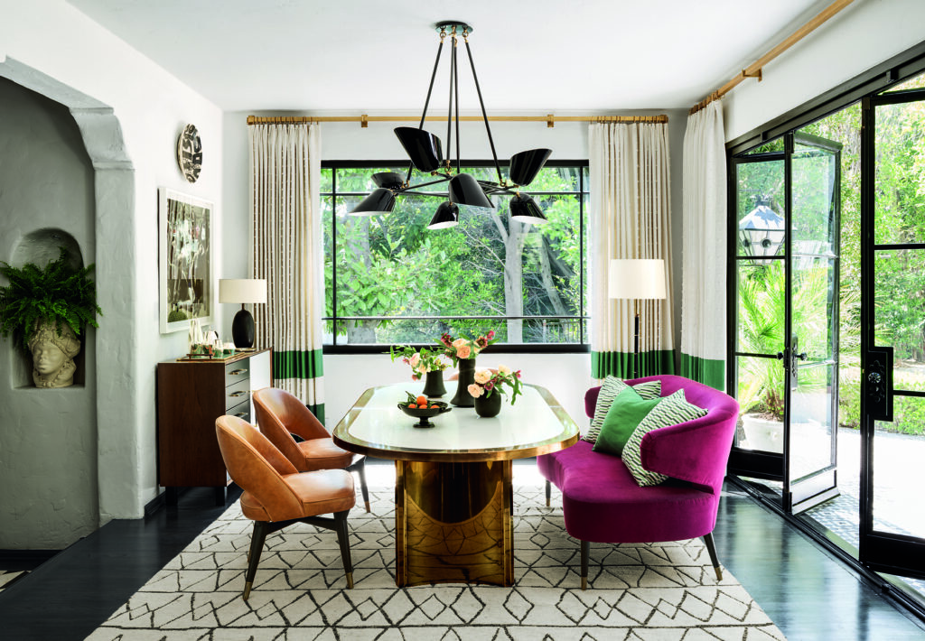 In Martyn Lawrence Bullard's home, a vintage brass dining table and Gio Ponti chairs (Photo by Douglas Friedman)