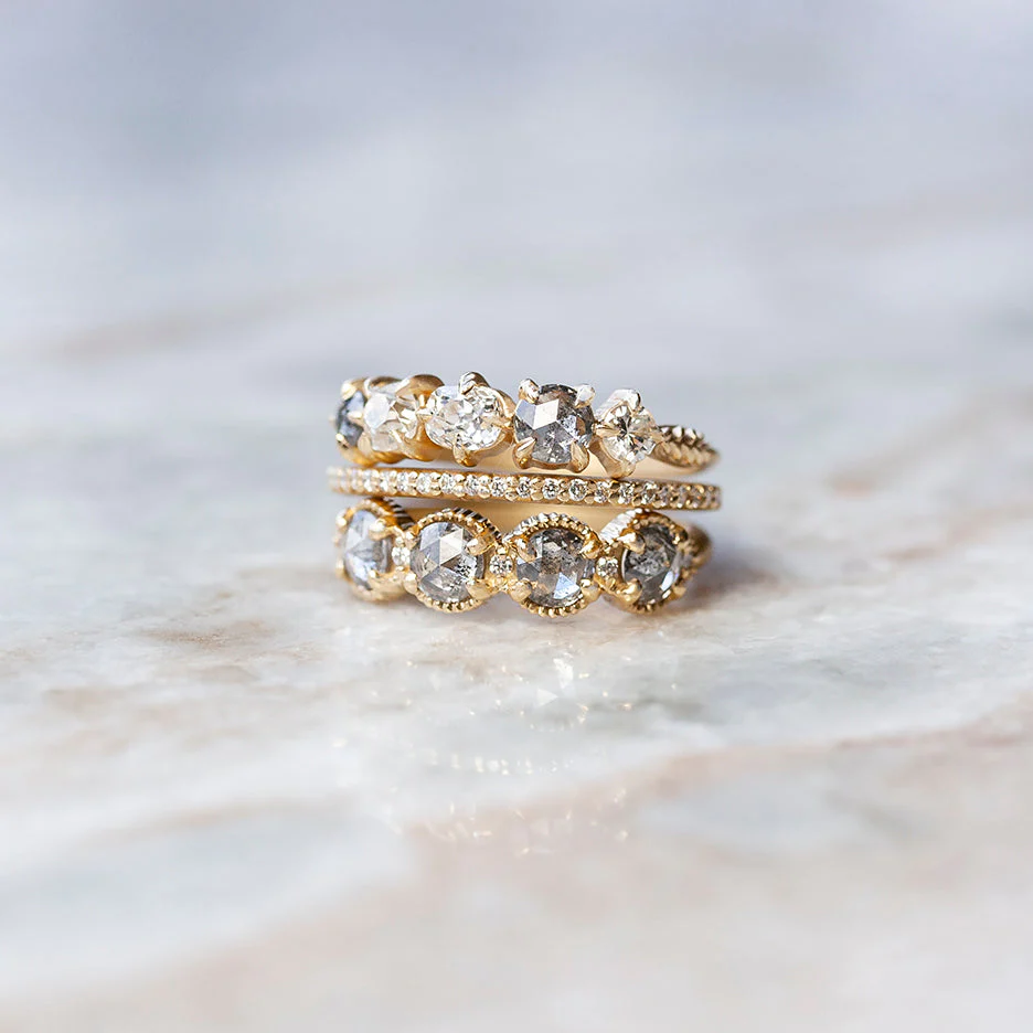 Megan Thorne ring toppers in ribbed rose cut salt and pepper diamonds with claw mounts are beyond unique.