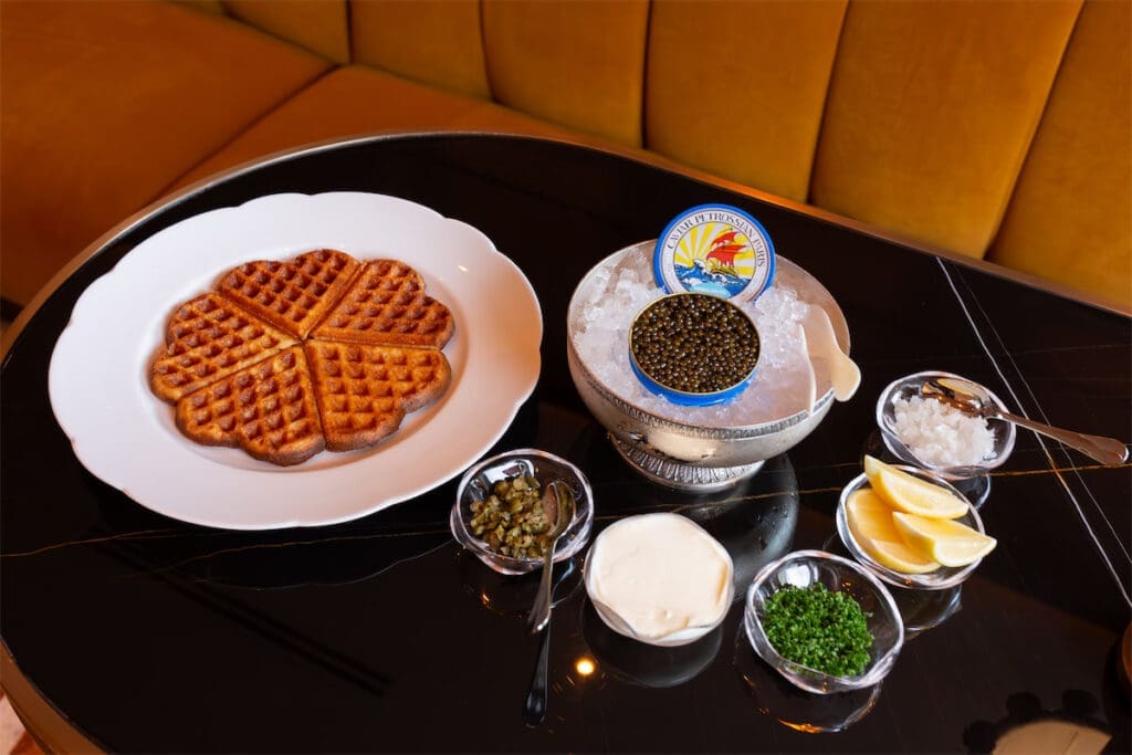 The food menu at Bar Colette features caviar waffles, duck, steak, and more.