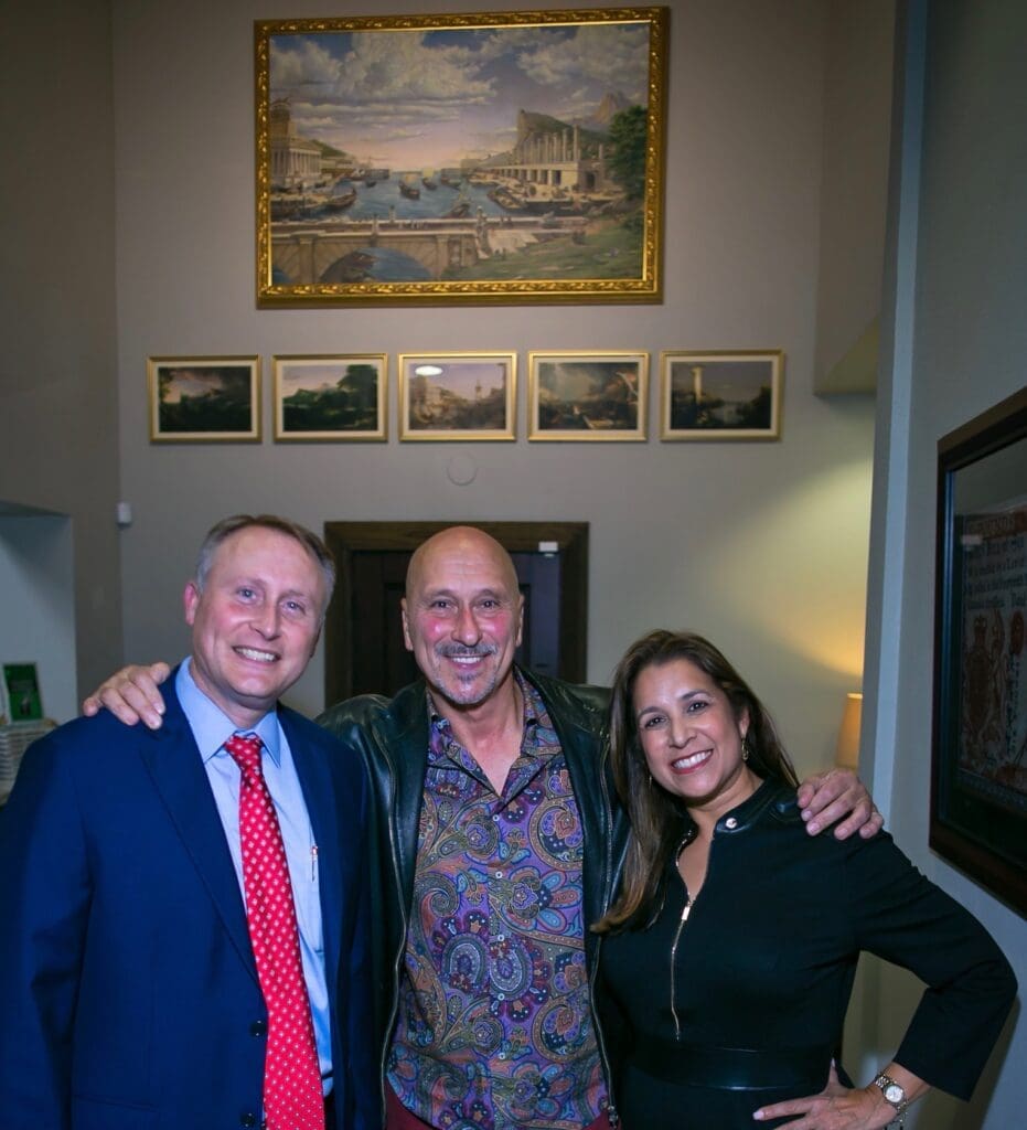 Author Chris Manske, painter Allan Rodewald, Jessica Manske at the author's book signing and 50th birthday. (Photo by Morris Malakoff)
