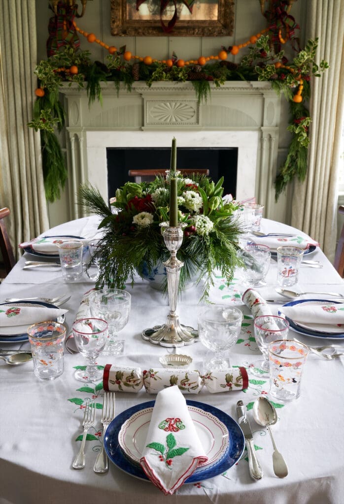 The table is set with Cathy Kincaid’s wedding china and pieces from her mother’s collection. Kincaid bought the custom-embroidered Constance Leiter tablecloth and napkins from Neiman Marcus more than 40 years ago. (Photo by Pär Bengtsson)