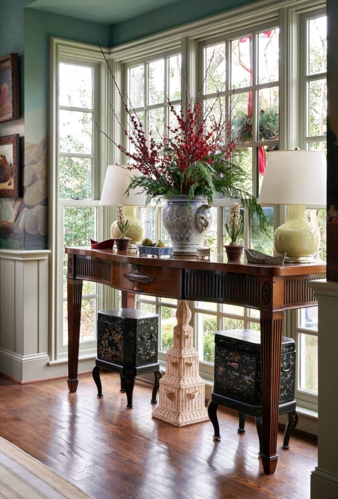English 19th-century console, Amanda Lindroth’s wicker pagoda and pair of Chinese tea caddies made into tables. Christopher Spitzmiller lamps. (Photo by Pär Bengtsson)