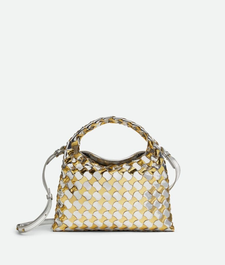 Bottega Veneta's silver and gold mirror laminated mini hop Intrecciato hobo bag.