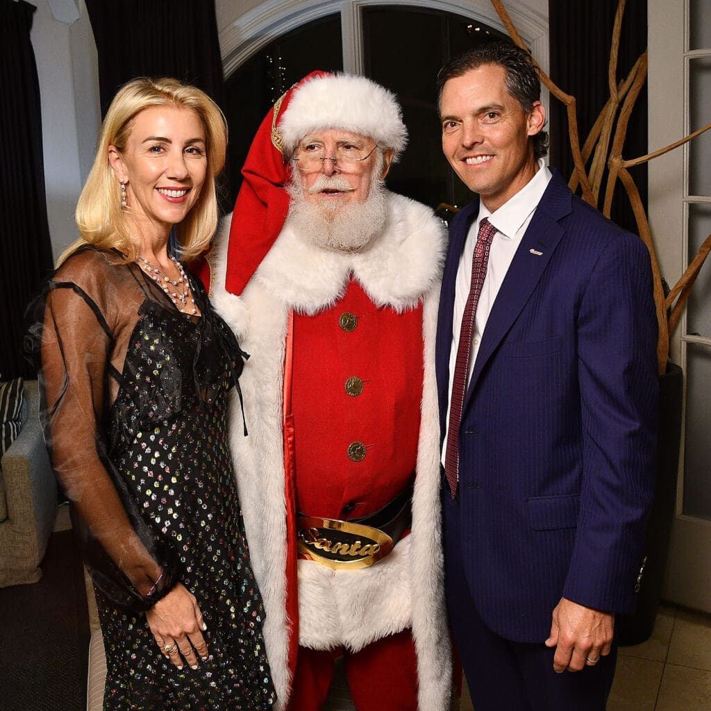 Cathy & David Herr with Santa at the MD Anderson Children's Cancer Hospital Santa's Elves fundraiser at the Fertitta family home.