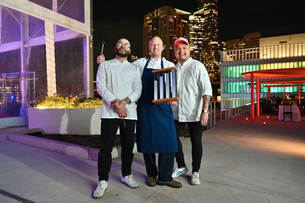 Chefs Paul Qui, Chris Haatuft, Tom Cunanan cooking at the Baylor College of Medicine 'Culinary Stars Shine for Cancer Research' dinner at POST Houston (Photo by Alejandro Montoya)