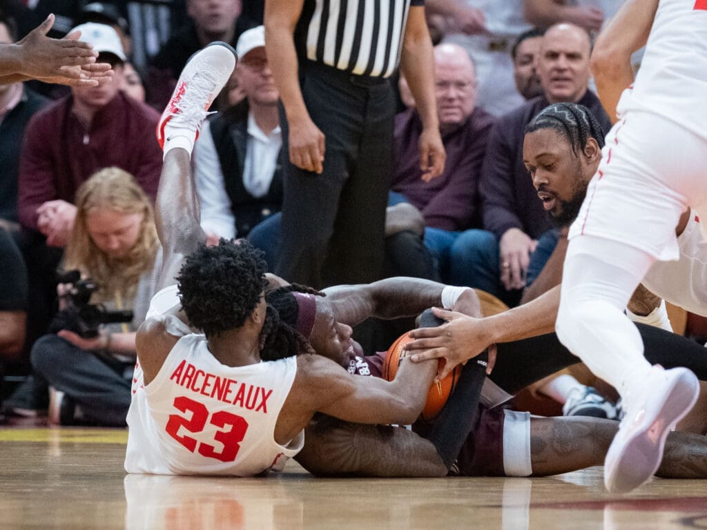 University of Houston wing Terrance Arceneaux and J'Wan Roberts aren't afraid to fight for the basketball. (Photo by F. Carter Smith)