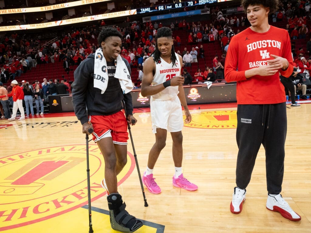 Terrance Arceneaux limped off the Toyota Center court last December, but his UH teammates kept his spirts up. (Photo by F. Carter Smith)