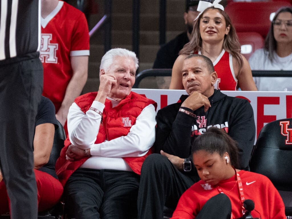 Bill Worrell and former UH standout Otis Birdsong took in the scene at the Fertitta Center. (Photo by F. Carter Smith)