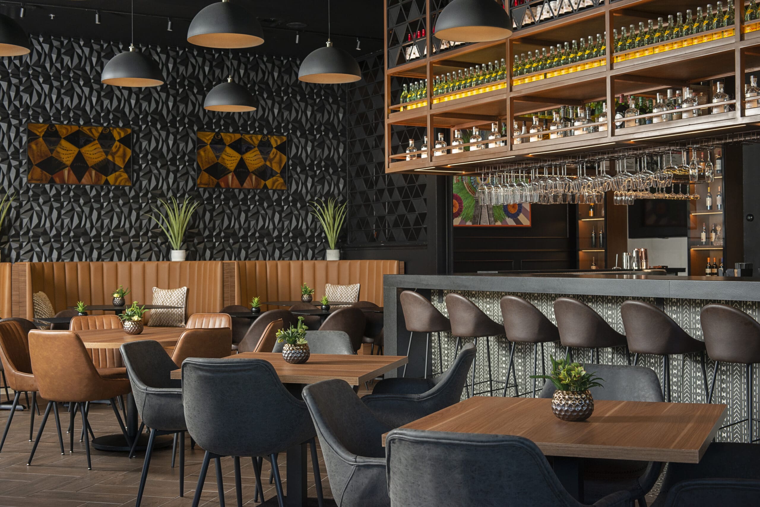 The sleek modern interior of Monarca can seat about 90 diners. The artworks are actually artfully disguised flat screen TVs. which only will be turned on for special occasions.
