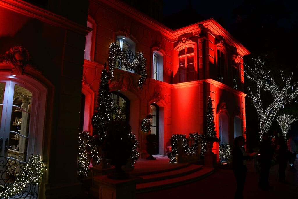 The Fertitta home in River Oaks alight in red for the holidays and for the Santa's Elves fundraiser.