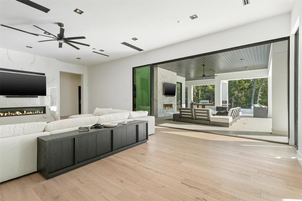 This near perfect Woodlands mansion has a seamless flow from inside to outside.
