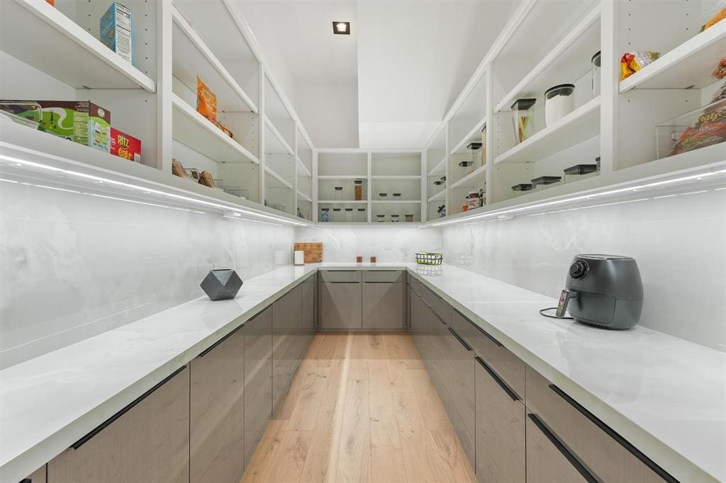 The Butler's Pantry is a subtle addition to the kitchen, perfect for storing appliances and preparing meals. 