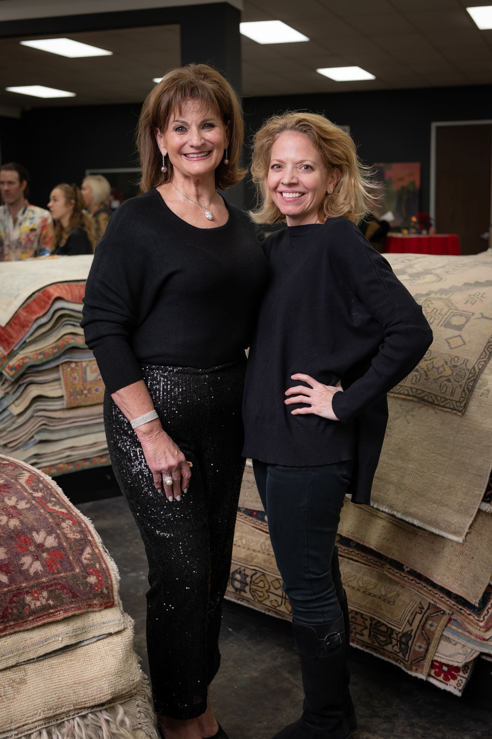 Wreath design winner Beth Dow, Julie Sacco at the Turkish Rug Company showroom grand opening party benefiting the Salvation Army.