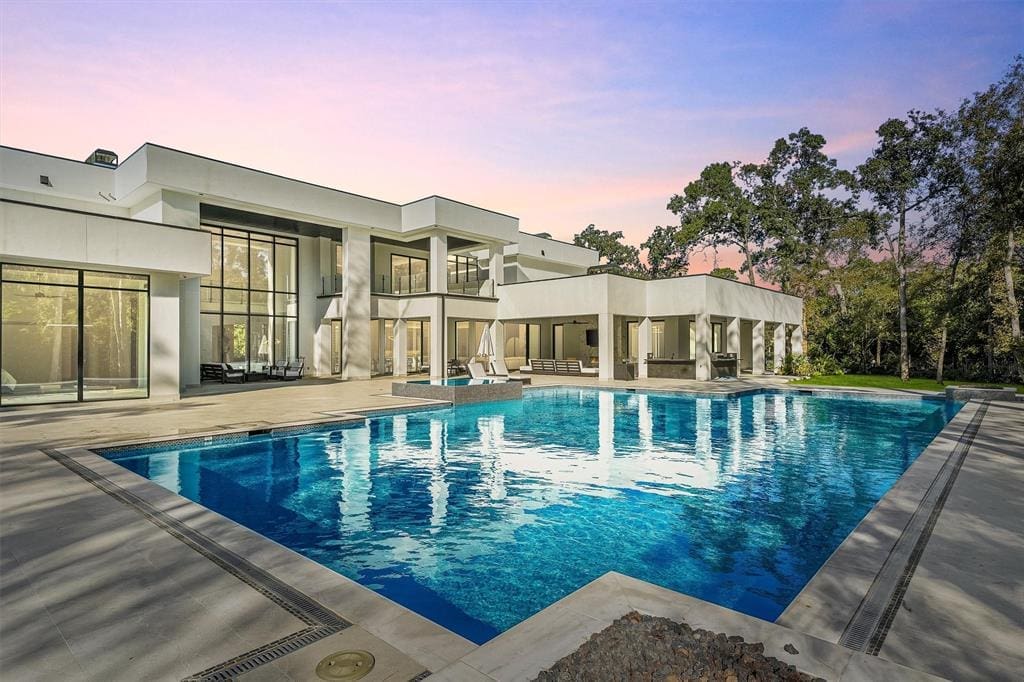 This pool could be your own private oasis with just trees to the back.