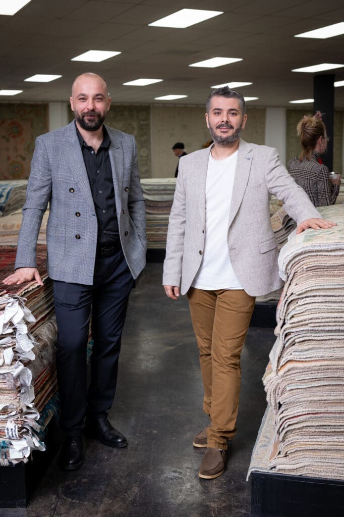 Owner Veli Soylemez, Zac Cetin at Houston Design Center for the Turkish Rug Company showroom grand opening party benefiting the Salvation Army.