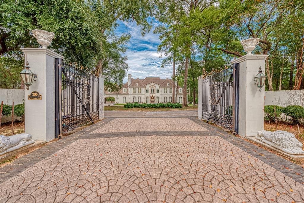 Timeless style and elegance beckons at 206 N Tranquil Path Drive in The Woodlands.
