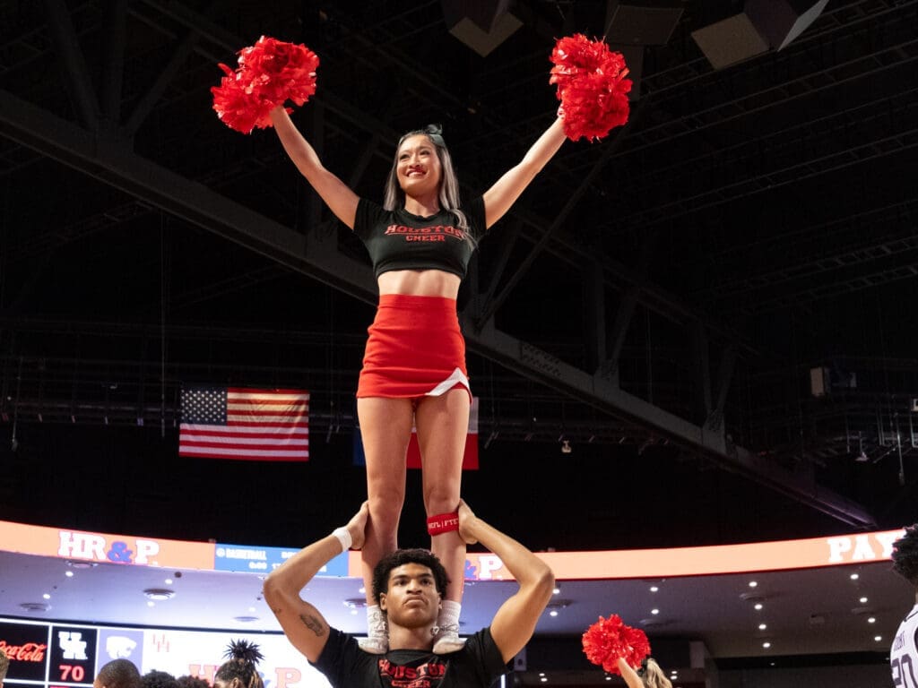 The cheerleaders add to the atmosphere at Fertitta Center. (Photo by F. Carter Smith)