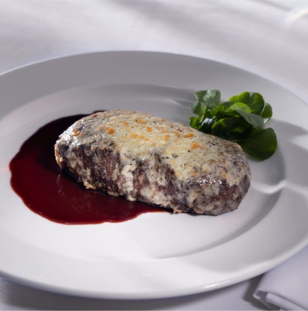 Capital Grille serves a spectacular gorgonzola-crusted dry aged New York strip, enhanced by a tart cherry cabernet reduction.