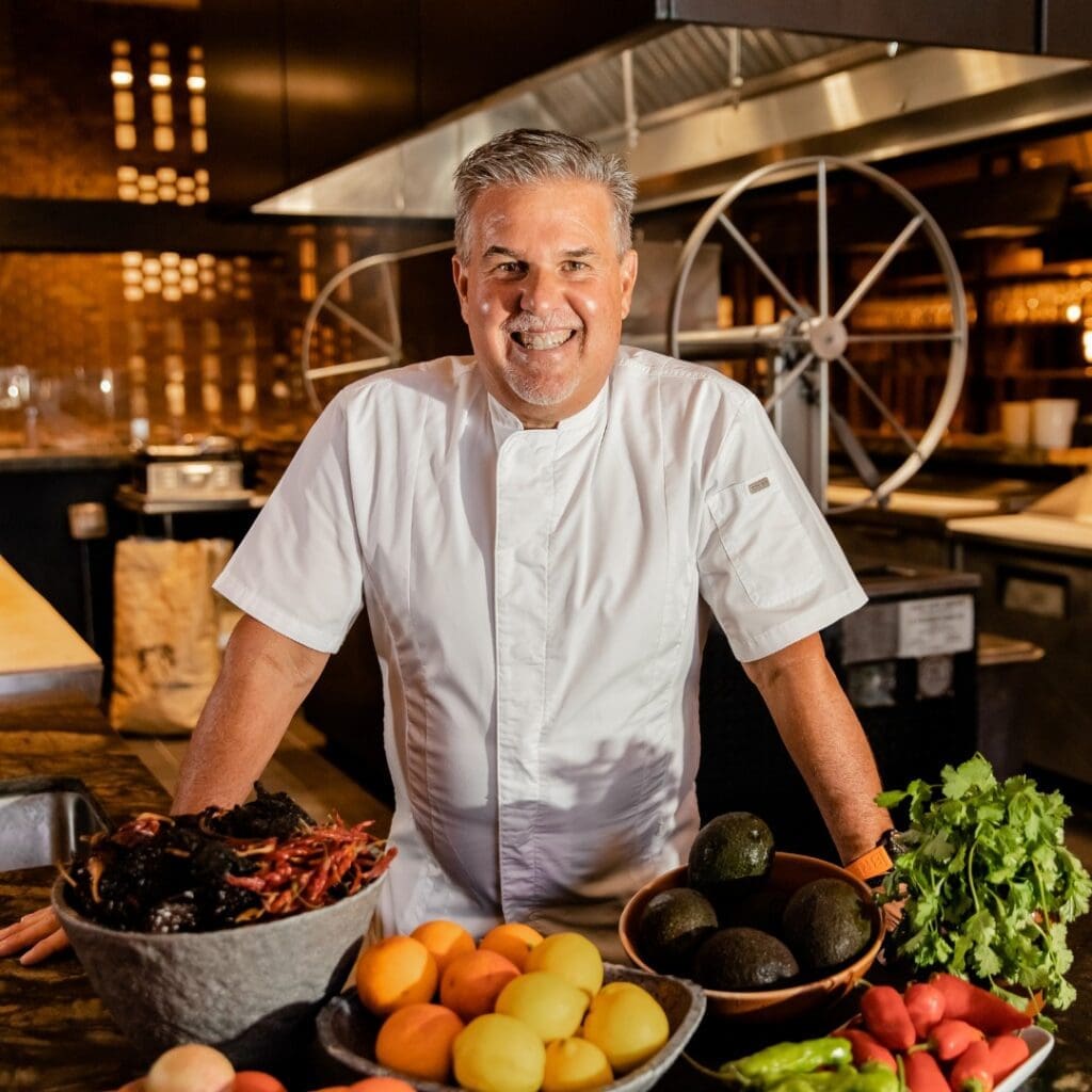 Chef Richard Sandoval mans the open, central wood grilling station at his Toro Toro.
