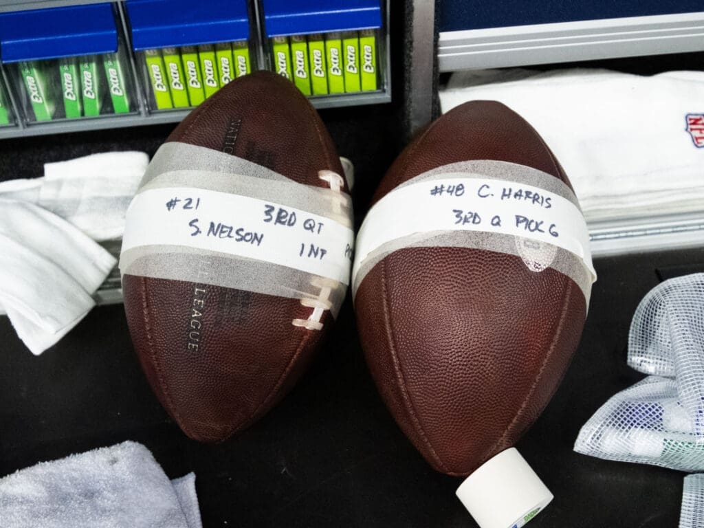 The back to back Pick 6 footballs for Texans are put aside for souvenir safe keeping. (Photo by F. Carter Smith)