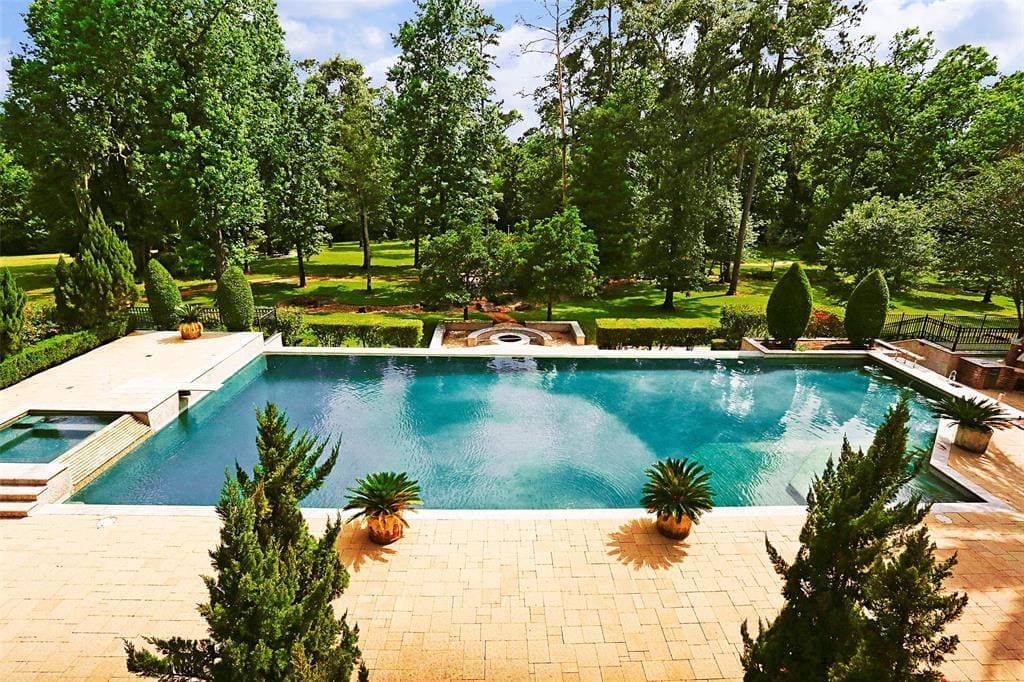 Perfect landscaping and a contemporary pool are among the features at S 126 Tranquil Path. 