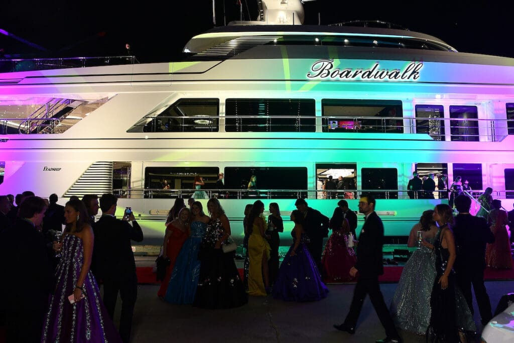 Guests gather at Tilman Fertitta's mega yacht Boardwalk at the San Luis Salute in Galveston. (Photo by Dave Rossman)