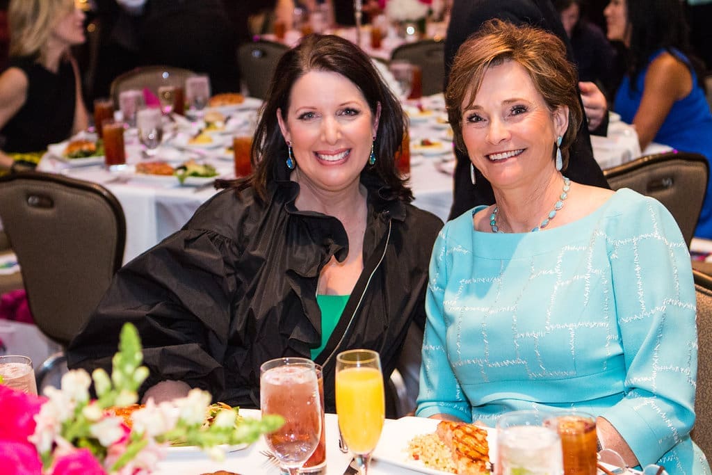 Elizabeth Anthony founder and owner Julie Roberts with Bobbie Nau at a Children's Assessment Center luncheon benefit.