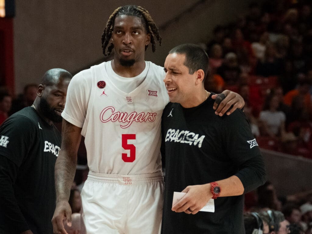 University of Houston center Ja'Vier Francis and assistant coach Kellen Sampson have a bond. (Photo by F. Carter Smith)