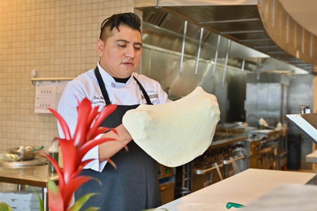 Magdalena's executive chef Luis Silva prepares Neapolitan-style pizza at this new West University Italian spot. (Photo by Alex Montoya)