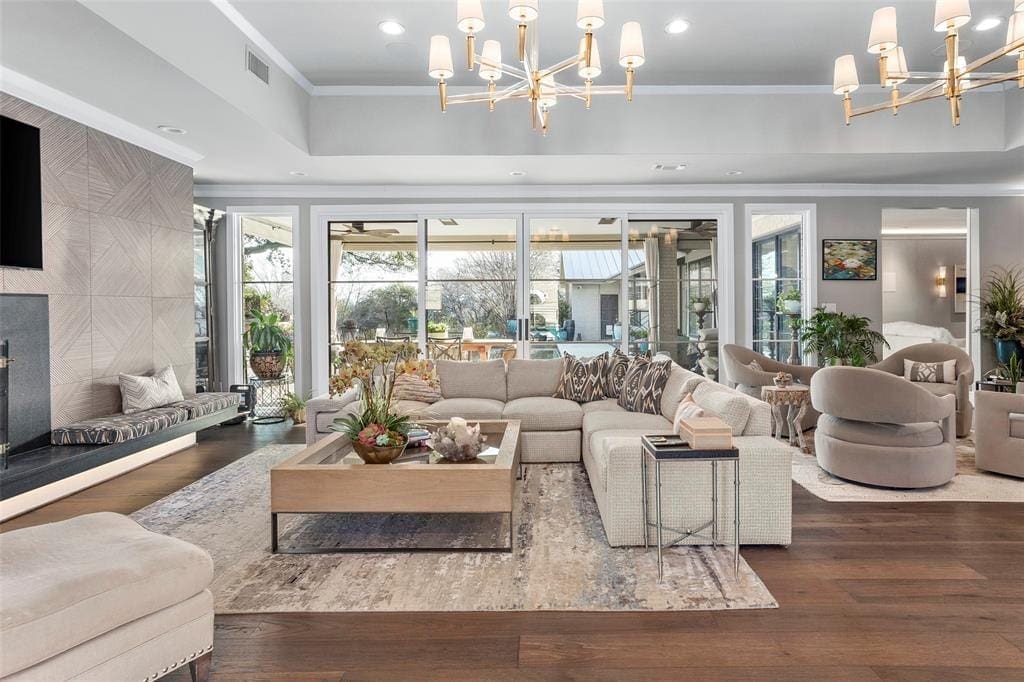 At 1401 Westover Lane, the sunken living room with modern lighting and stone fireplace surround. (Courtesy photo)