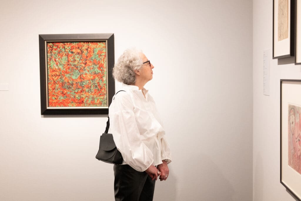 Jill Snyder viewing the Janet Sobel exhibition at The Menil Collection. (Photo by Daniel Ortiz)