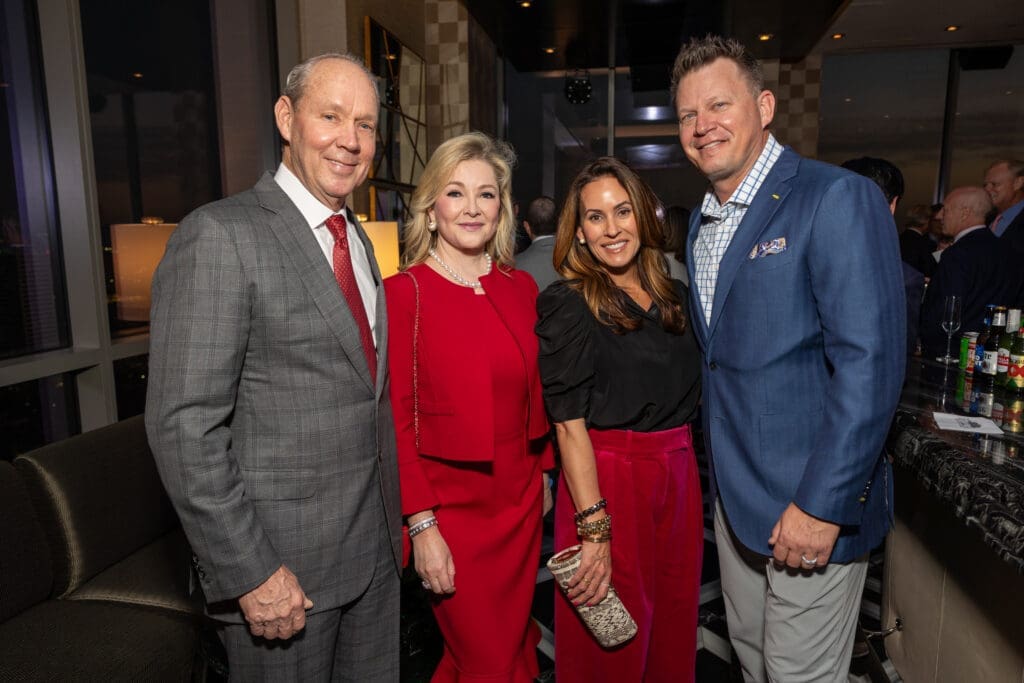 Jim & Whitney Crane, Kory & Geoff Blum at the Texas Children's Houston Open Tee-Off in the penthouse suite at the Post Oak Hotel.  (Photo by Jenny Antill)