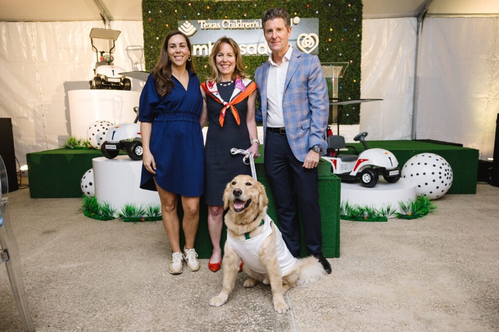 Julia TenHoeve, Debbie Sukin, Brian White with Pawsitive Play “caddie,” Cohen at Texas Children's Hospital 'Glow in the Park' event (Photo courtesy of Texas Children's Hospital