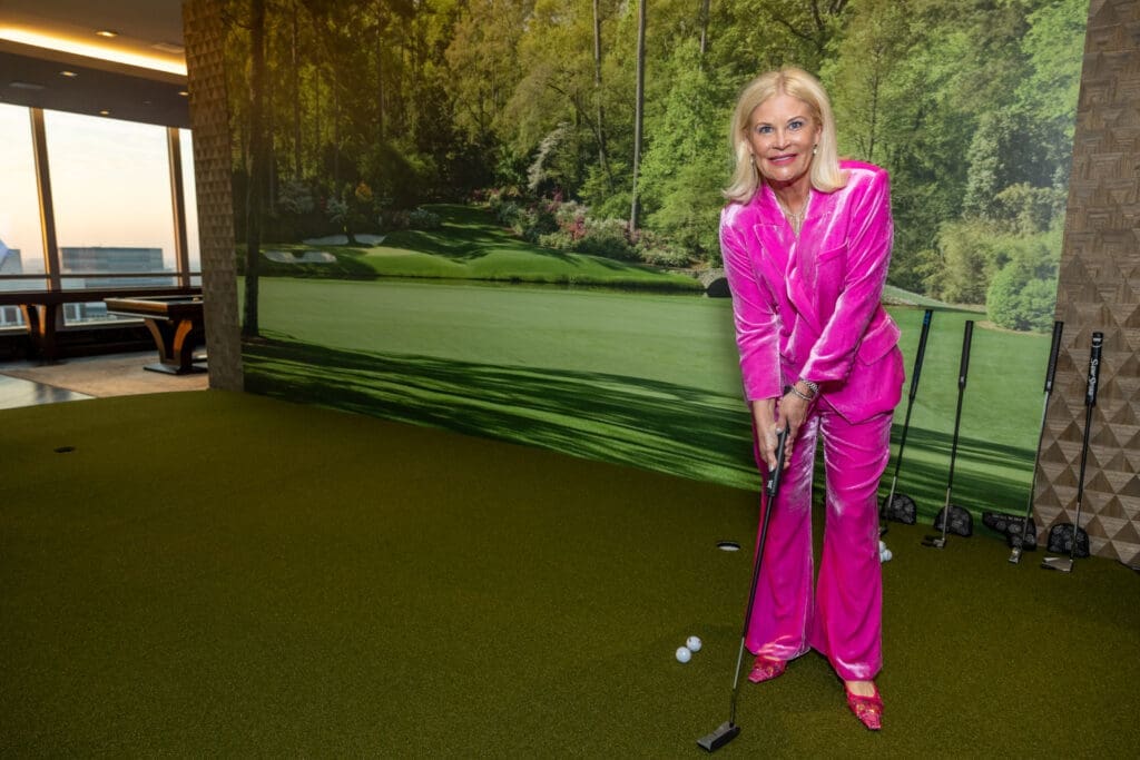 Kelli Blanton on the temporary putting green at the Texas Children's Houston Open Tee-Off in the penthouse suite at the Post Oak Hotel.  (Photo by Jenny Antill)