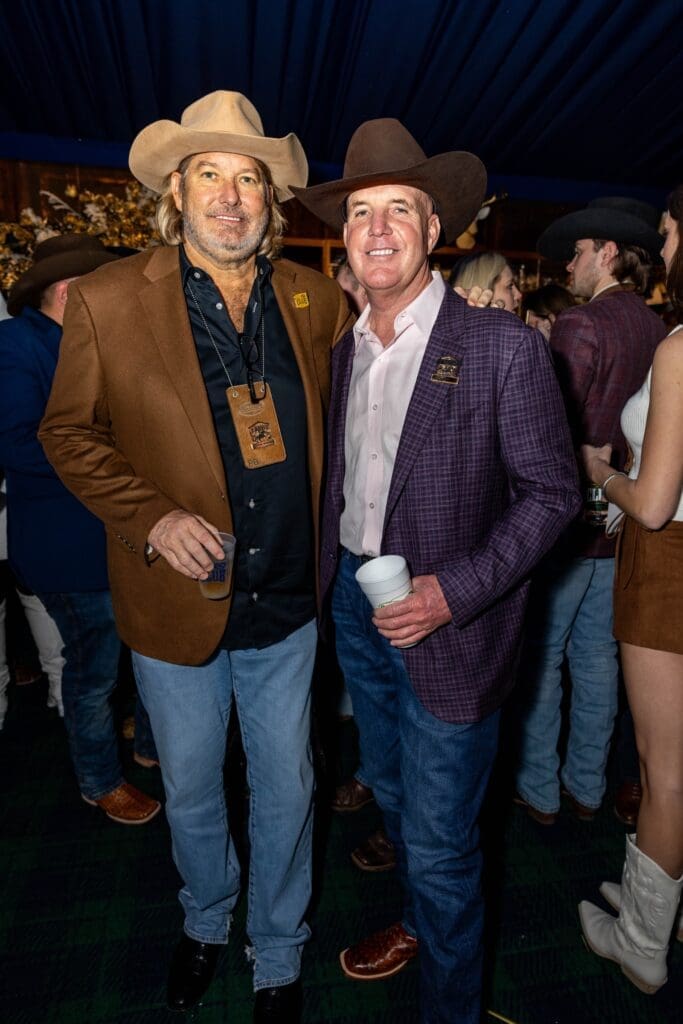Cotton Holdings Inc. CEO Pete Bell, Quanta Services president and CEO Duke Austin in the Cotton 'Q Club at RodeoHouston. (Photo courtesy of Cotton Holdings Inc.)