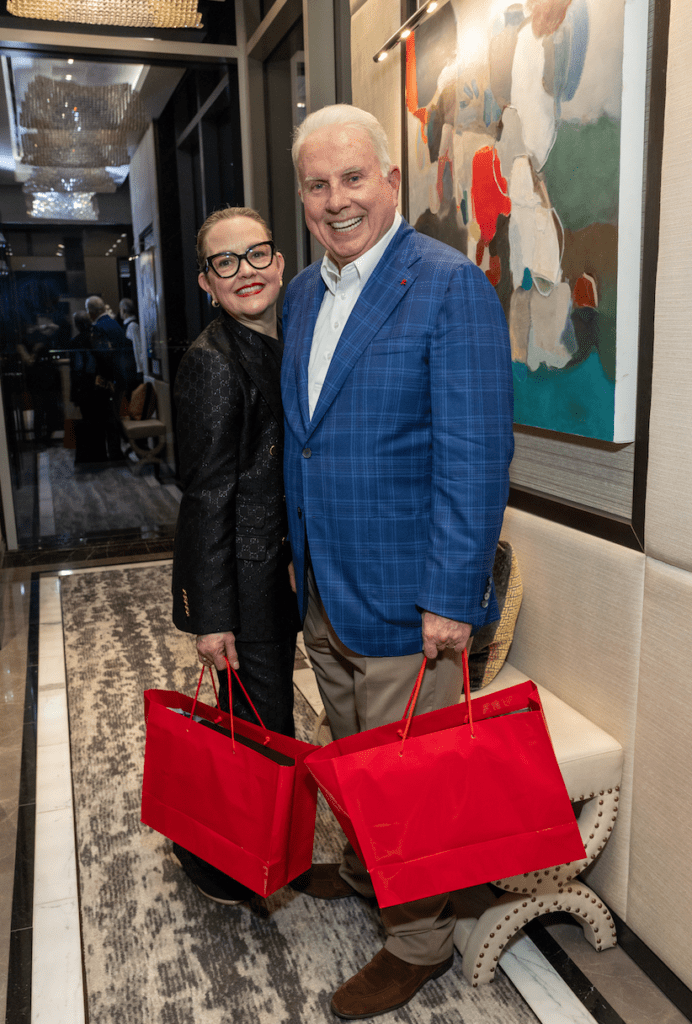 Shannon & Mark A. Wallace at the Texas Children's Houston Open Tee-Off party held in the two-story penthouse suite at Fertitta's Post Oak Hotel.  (Photo by Jenny Antill)