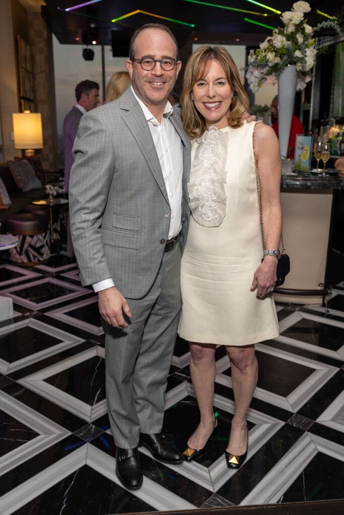 Steve & Debbie Sukin, Texas Children's Hospital president,, at the Texas Children's Houston Open Tee-Off in the penthouse suite at the Post Oak Hotel.  (Photo by Jenny Antill)
