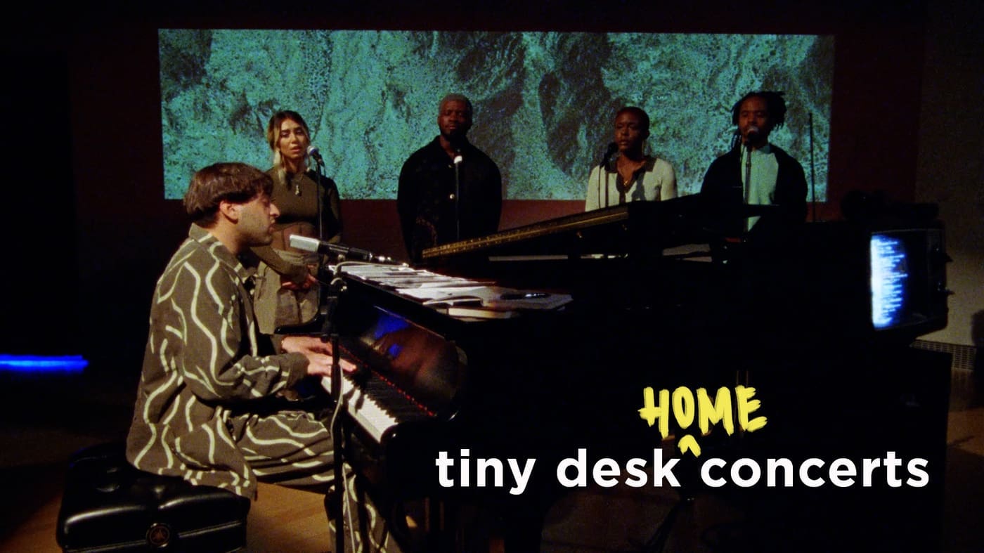 Samora Pinderhughes, pianist and composer, performed with vocalists and musicians during his Tiny Desk (Home) concert for NPR, which debuted April 15, 2022. Songs played during the set include "The Cry/Masculinity," "Holding Cell," "Grief," and "Process." 