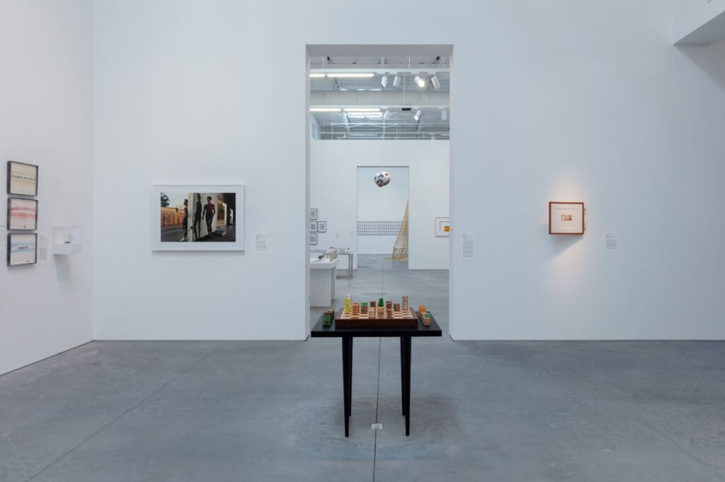 "For What It’s Worth: Value Systems in Art since 1960," The Warehouse, Dallas, installation view with work by Edward Kienholz (3 works), Antonio Vega Macotela, Philip-Lorca diCorcia, Agnieszka Kurant, and Chris Burden
(foreground); Lee Lozano (4 works), Michio Horikawa (6 works), Rirkrit Tiravanija, Eleanor Antin, John Latham (2 works), Steve McQueen, and Cildo Meireles (background), on view through June 29, 2024 (Photo by Kevin Todora)