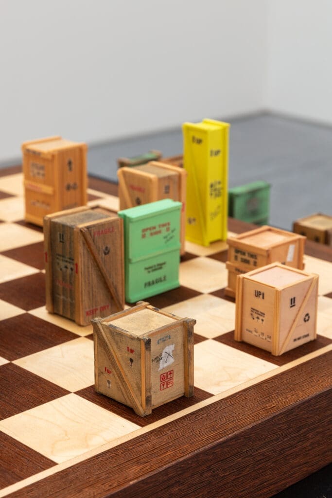 "For What It’s Worth: Value Systems in Art since 1960," The Warehouse, Dallas, installation view with detail of Agnieszka Kurant, Speculations (5),
2016, Chess board, wood, pigments, paper, metal, and custom table, on view through June 29, 2024 (Photo by Kevin Todora)