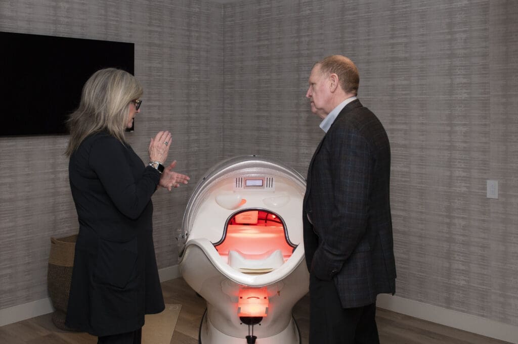A guest learning about Red Light Therapy from a Canyon Ranch expert. (Photo by Tamytha Cameron)