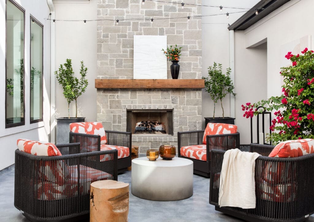 The courtyard is perfect for relaxing when the weather is good.  Lohman loves the pop of orange.