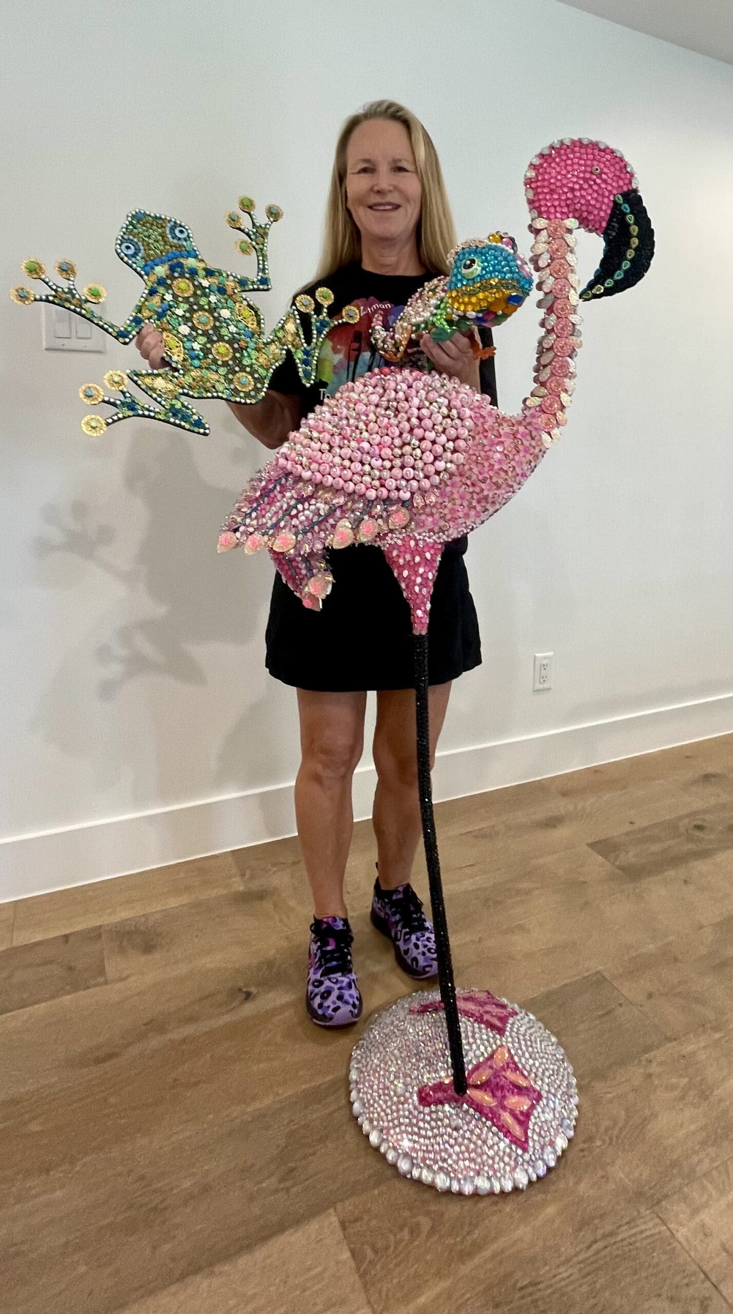 Assemblage artist Tonya Zitman with two of her pieces.