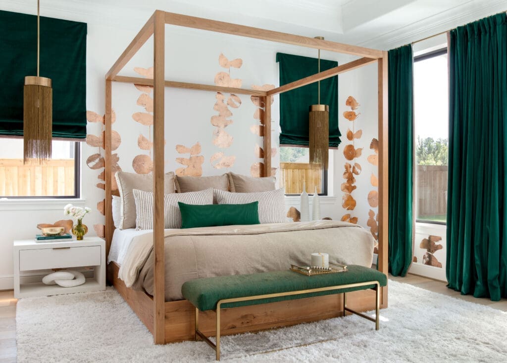 The primary bedroom is everyone's favorite, according to owner Heather Lohman, including the dog. The bold green velvet curtains one of the reasons why. (Photo by Kerry Kirk)