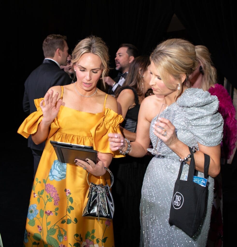 Raffle tickets and glittering jewels. Mel Kurkjian and Lindsay Minor. (Photo by Rachel DeLira)