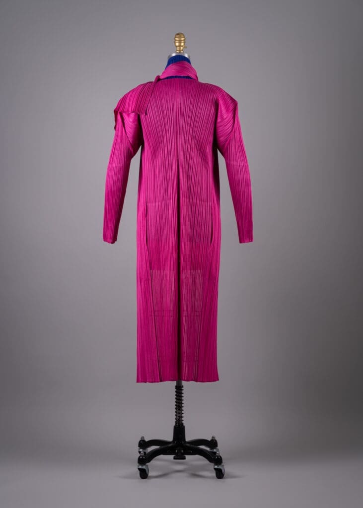 Back of Issey Miyake's pink polyester pleated coat and scarf, Fall 2004(Photo by Shane Quereshi)