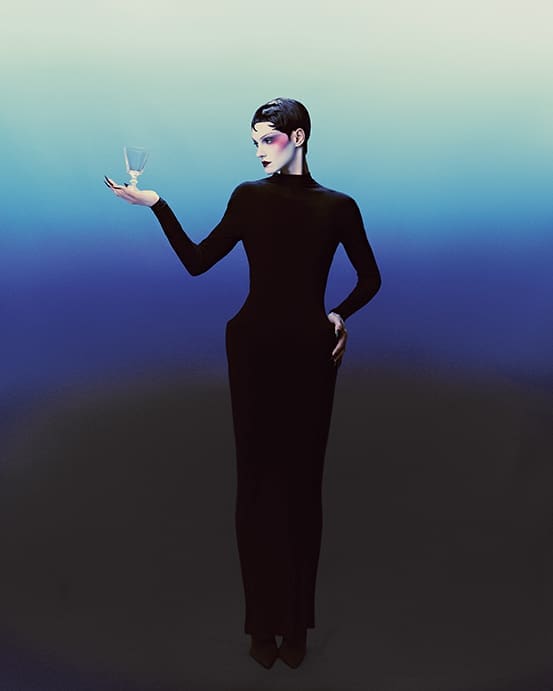 Balenciaga dress $2,790, and Hip Bone Pantabodysuit $5,690, at the Balenciaga boutique, Neiman Marcus. Ichendorf Milano Parigi Wine Glass, $20 at Nickey Kehoe at nickeykehoe.com. 