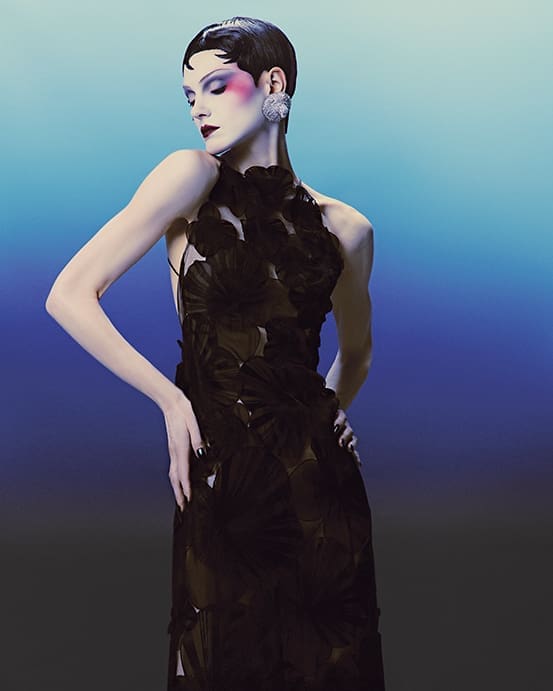 Akris tulle gown with anemone silk organza flowers $9,950 at Akris Highland Park Village, Neiman Marcus, Balmain lion earrings in brass with crystals, at Balmain Highland Park Village, Neiman Marcus. 