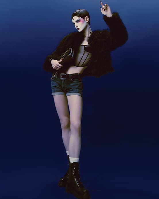 Celine by Hedi Silmane embroidered cardigan in goat cashmere, bustier top in silk organza $1,950, mini shorts $1,100, Marco belt $640, Triomphe socks $165, Victoire bag $3,850, and Triomphe Rangers lace-up boot $1,500 at Celine Highland Park Village, Forty Five Ten. 
